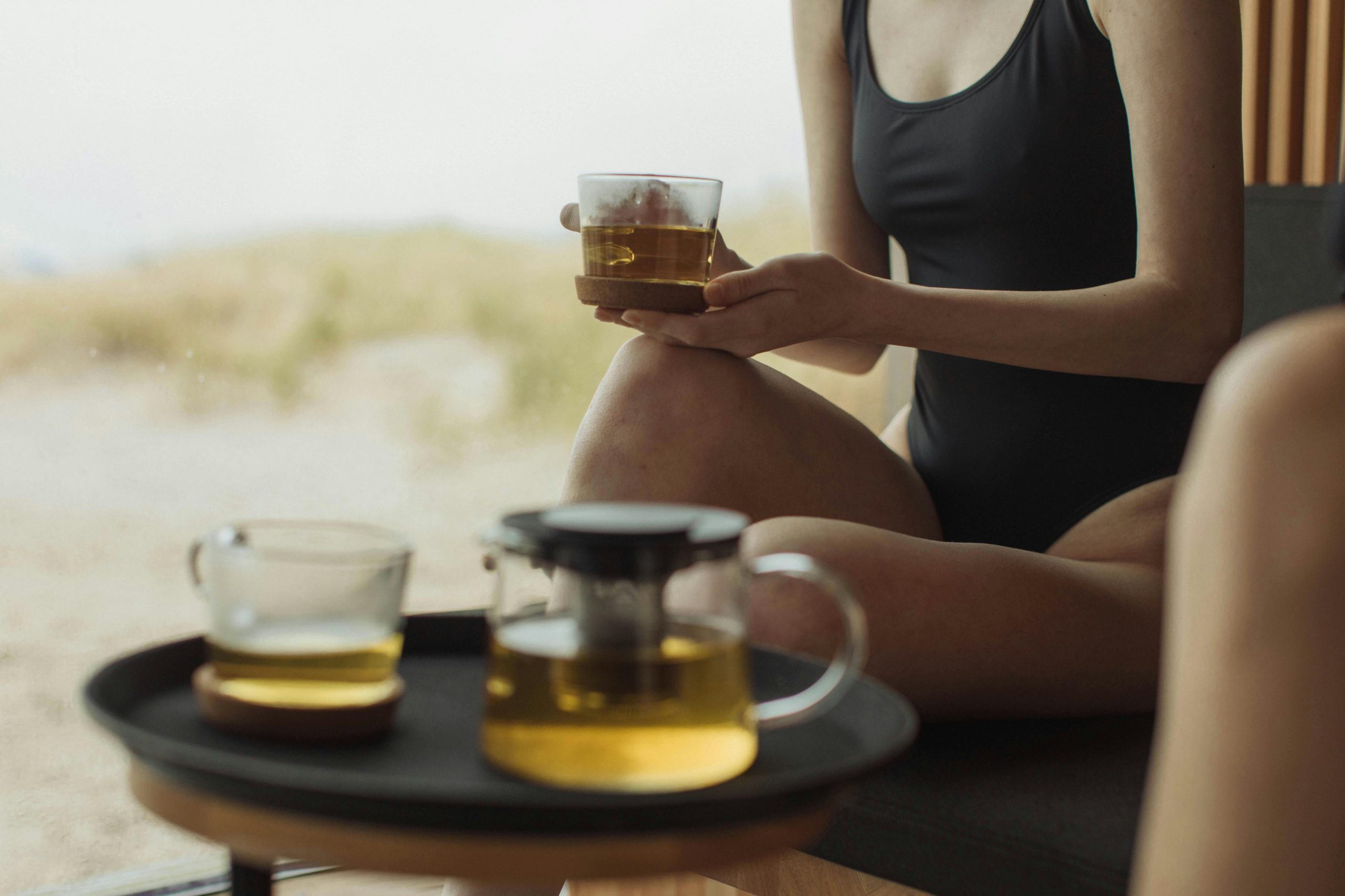 A woman enjoying herbal tea, apart of spa culture